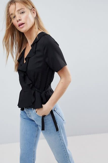 Get it <a href="http://us.asos.com/asos/asos-wrap-top-with-ruffle-detail/prd/8980747?clr=black&amp;SearchQuery=wrap%20top&amp;gridcolumn=3&amp;gridrow=1&amp;gridsize=4&amp;pge=1&amp;pgesize=72&amp;totalstyles=426" target="_blank">here</a>.&nbsp;