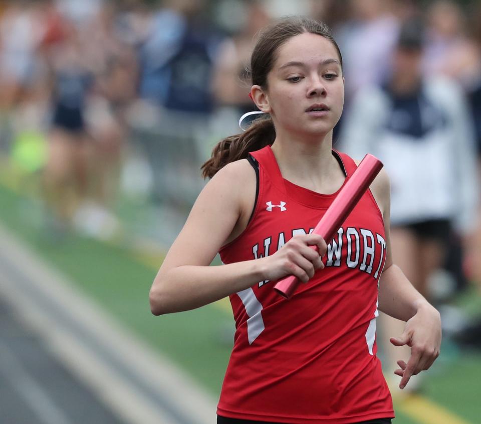 Wadsworth anchor Rowan King crosses the finish line in the 3,200-meter relay during the Suburban League National Conference track and field championships at Twinsburg, Tuesday, May 7, 2024.