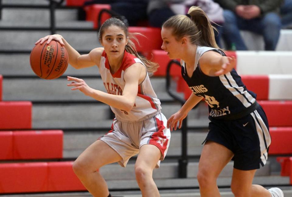 Bellefonte’s Maria Cotter dribbles around Penns Valley’s Scotty Dinges during the game on Monday, Jan. 23, 2023.