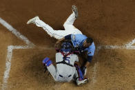 Tampa Bay Rays' Manuel Margot is tagged out at home by Los Angeles Dodgers catcher Austin Barnes trying to steal during the fourth inning in Game 5 of the baseball World Series Sunday, Oct. 25, 2020, in Arlington, Texas. (AP Photo/David J. Phillip)