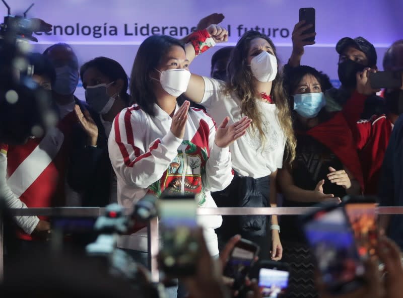 FILE PHOTO: Peru's presidential candidate Keiko Fujimori applauds to supporters while leading a demonstration in Lima