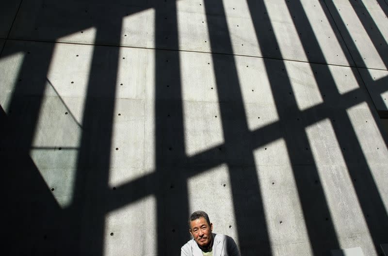 FILE PHOTO: Japanese designer Issey Miyake poses at a photo opportunity at the exhibition "U-Tsu-Wa" in Tokyo