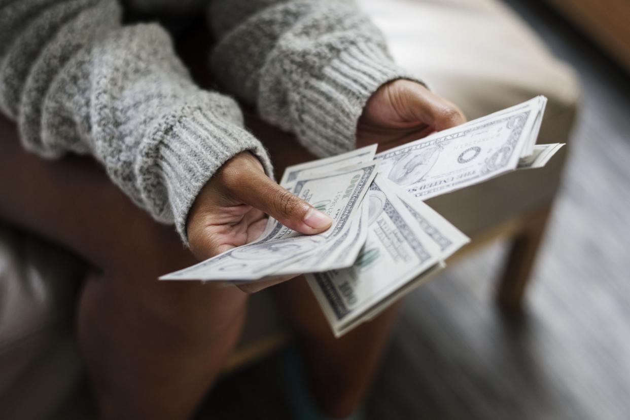 Closeup of woman counting money