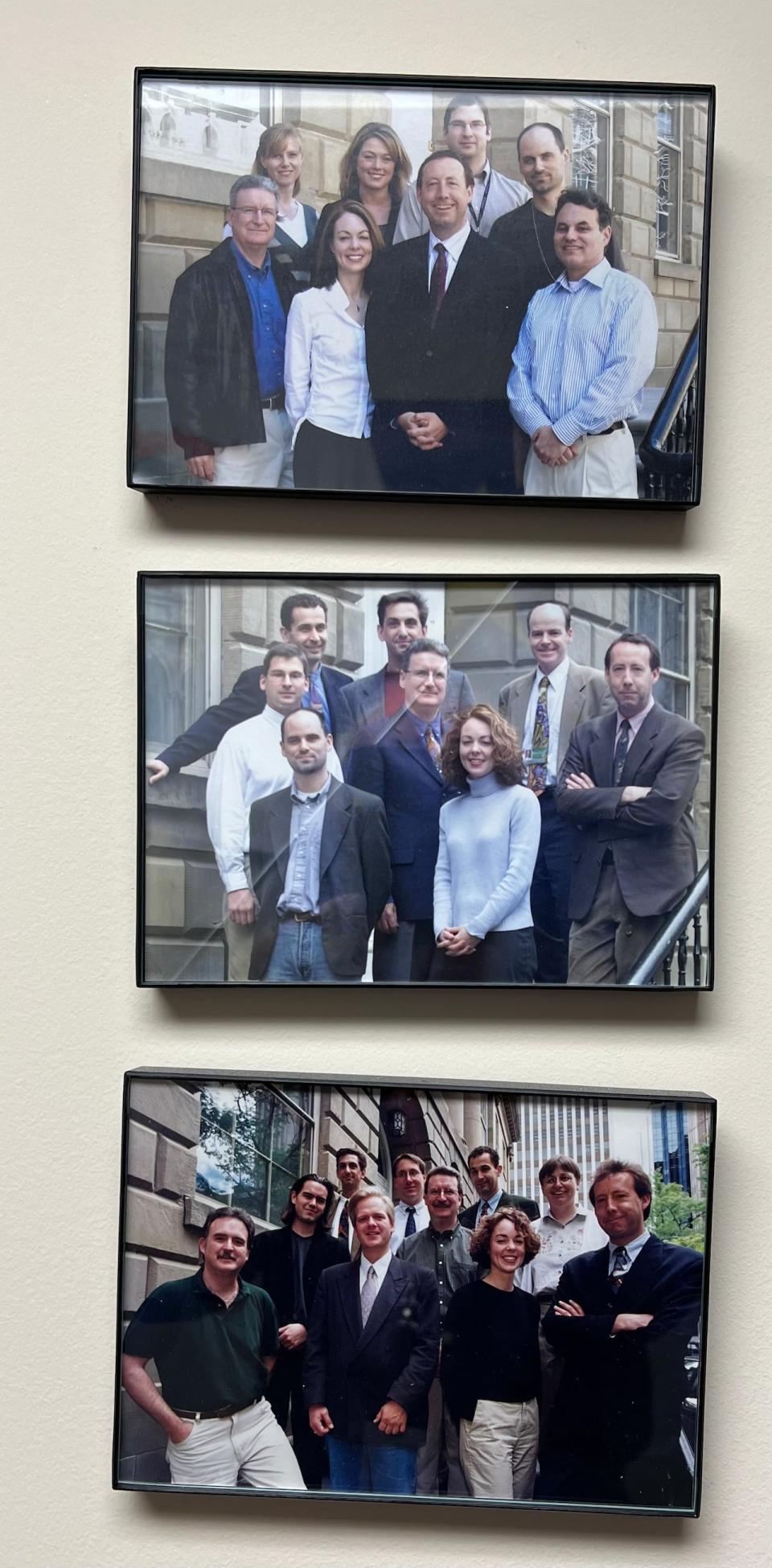 Legislative reporters are shown through the years on the steps outside Province House.