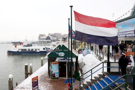 FILE PHOTO: A Dutch flag in the port of Volendam near Amsterdam