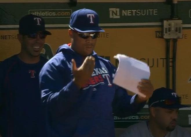 Adrian Beltre sends in some defensive signs during Saturday's game in Oakland. (MLB screen grab)