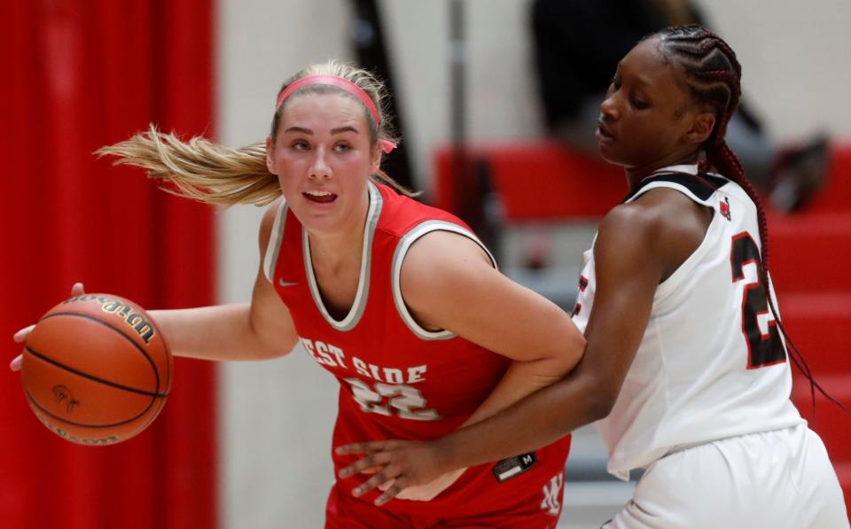 West Lafayette Red Devils guard Kennedy Martin (22) dribbles past Lafayette Jeff Bronchos Amani Byrd (2) during the IHSAA girl’s basketball game, Tuesday, Jan. 17, 2023, at Lafayette Jeff High School in Lafayette, Ind. 