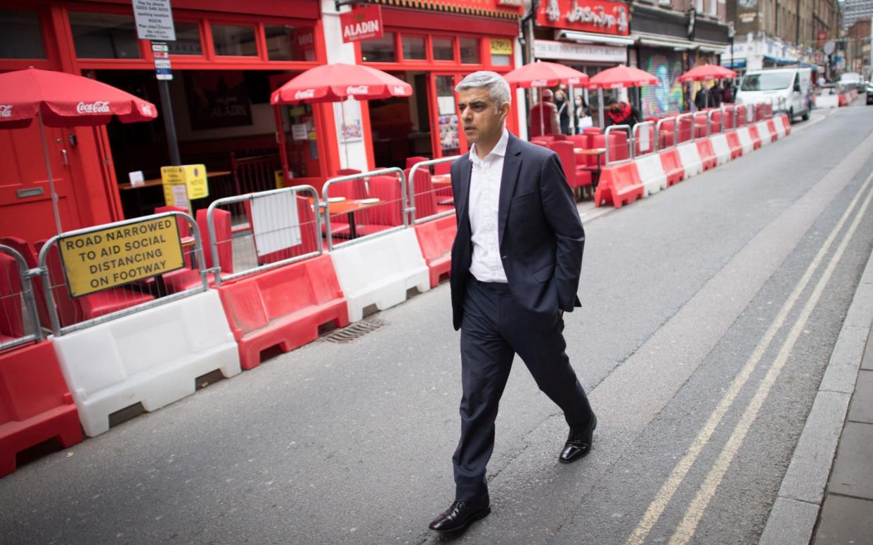 Labour's Mayor of London Sadiq Khan walks along Brick Lane in East London on his way to Spitalfields City Farm as part of his campaign to be re-elected - Stefan Rousseau/PA