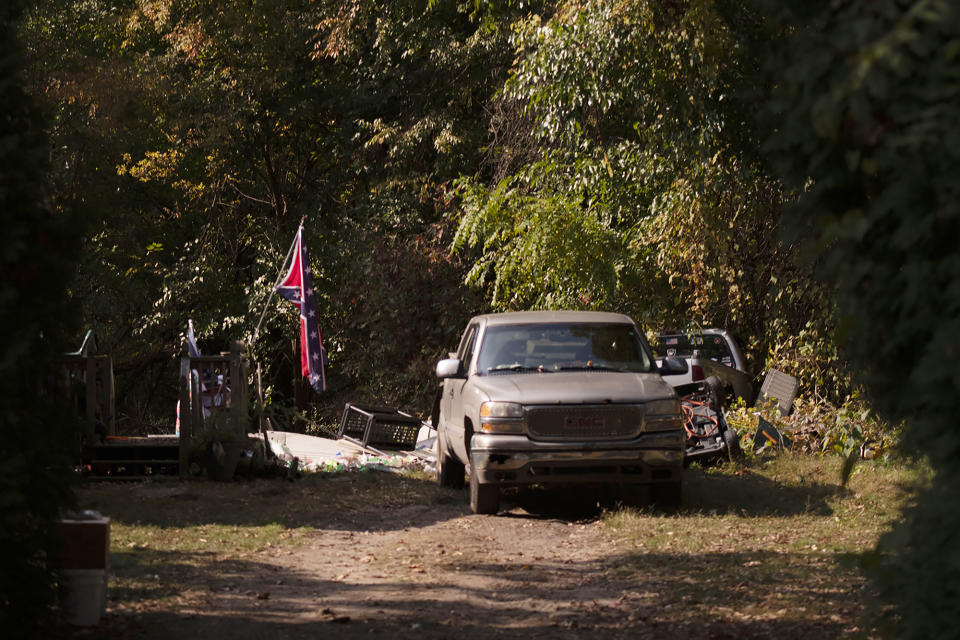 FILE - A confederate flag hangs from a porch on a property in Munith, Mich., Oct. 9, 2020, where law enforcement officials said suspects accused in a plot to kidnap Michigan Democratic Gov. Gretchen Whitmer met to train and make plans. Four members of anti-government groups are on trial on federal charges accusing them of plotting to abduct Whitmer in 2020. (Nicole Hester/Ann Arbor News via AP, File)