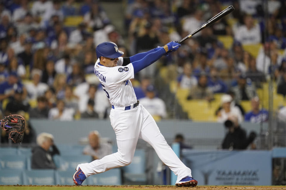 Los Angeles Dodgers designated hitter Trayce Thompson (25) hits a home run during the third inning of a baseball game against the Colorado Rockies in Los Angeles, Monday, Oct. 3, 2022. (AP Photo/Ashley Landis)