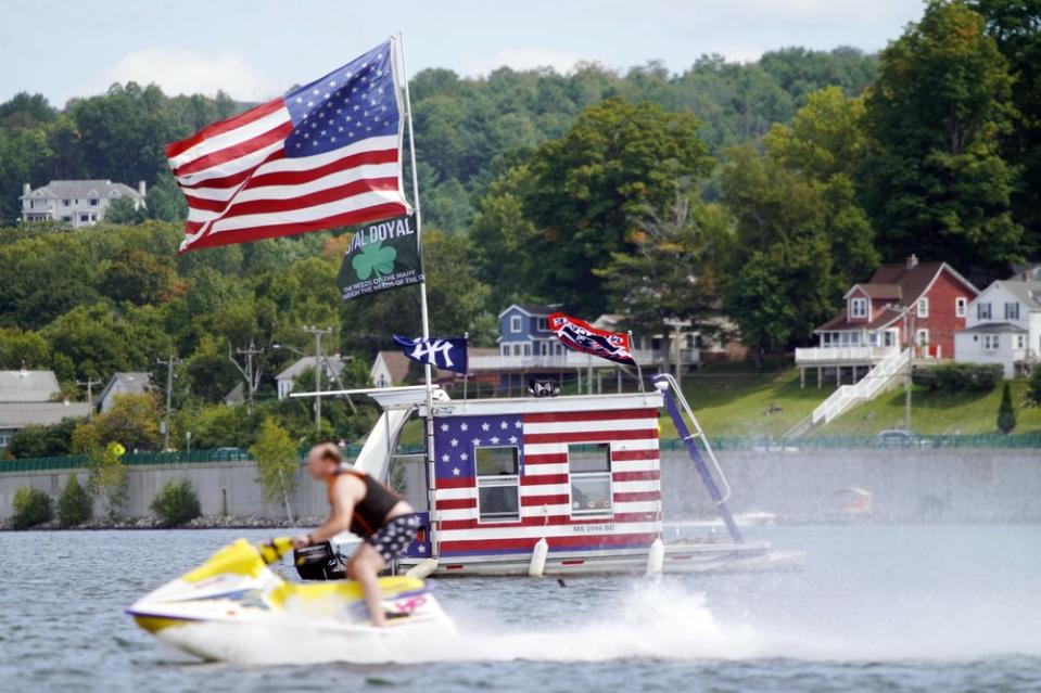 A jet skier passes a patriotic shanty-boat on Labor Day,  Monday September 7. Source: AP