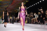 <p>Dua Lipa opened and closed the Versace show, which this season took inspiration from the transformative powers of the house's iconic silk foulard, or scarves, taking pieces of fabric and "haphazardly" fastening and embellishing with another recognisable brand signature; the safety pin. </p><p>"The foulard is a fundamental component of Versace’s heritage and character," said Donatella Versace. "It’s acted as a canvas for our iconic prints and is worn in multiple ways from knotted tops to headscarves to bag accessories - it’s a way of adding Versace attitude to any look. The foulard has been with us since the very beginning of the brand, but this season turns everything on its head, it is no longer fluid or dreamy, the scarf is provocative, sexy, wound tight." </p>