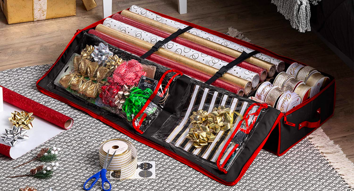 Sale of this gift wrap organizer are trending on Amazon wrapping paper storage bin filled with wrapping supplies