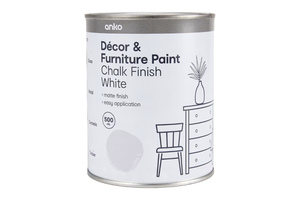 A can of Kmart's decor and furniture paint chalk finish white paint on a white background