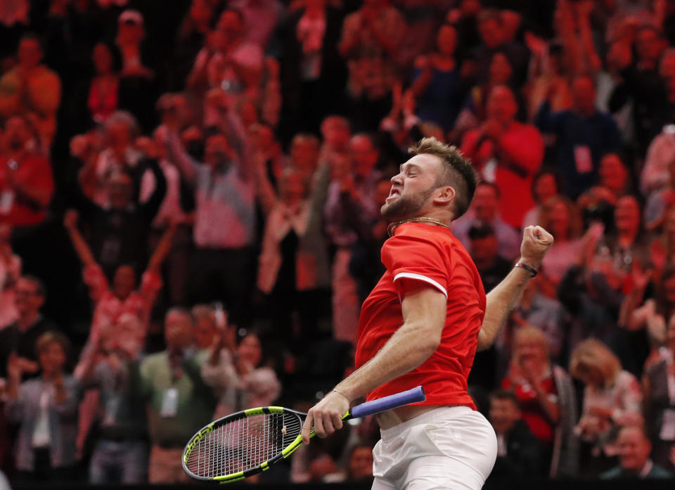 Team World's Jack Sock celebrates his team's win over Team Europe's Roger Federer and Alexander Zverev in a men's doubles tennis match at the Laver Cup, Sunday, Sept. 23, 2018, in Chicago. (AP Photo/Jim Young)