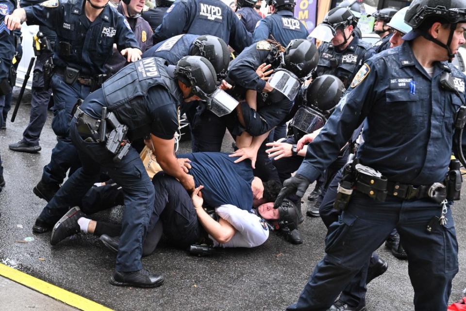 Cops could be seen dragging demonstrators away as the protesters fought back and yelled at the officers. Paul Martinka