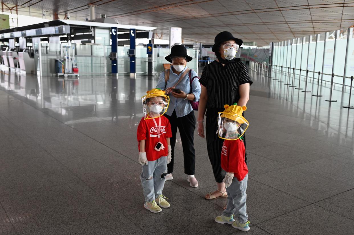 Beijing's airports cancelled more than 1,200 flights and schools in the Chinese capital were closed again on June 17 as authorities rushed to contain a new coronavirus outbreak: STR/AFP via Getty Images