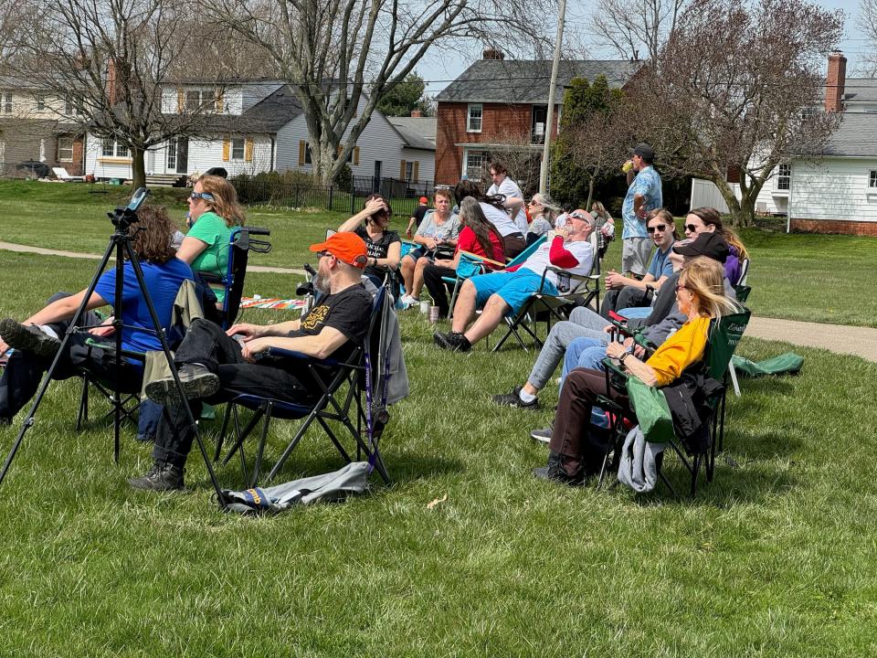 People get their spots at Freer Field in Ashland in anticipation of the total solar eclipse.