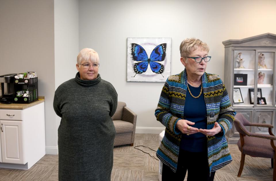 Executive Director Dr. Dina K. Rooney, left, and Marlene Mason, founder, discuss programs at Aunt Susie's Cancer Wellness Center, which has expanded into a larger space in Jackson Township.