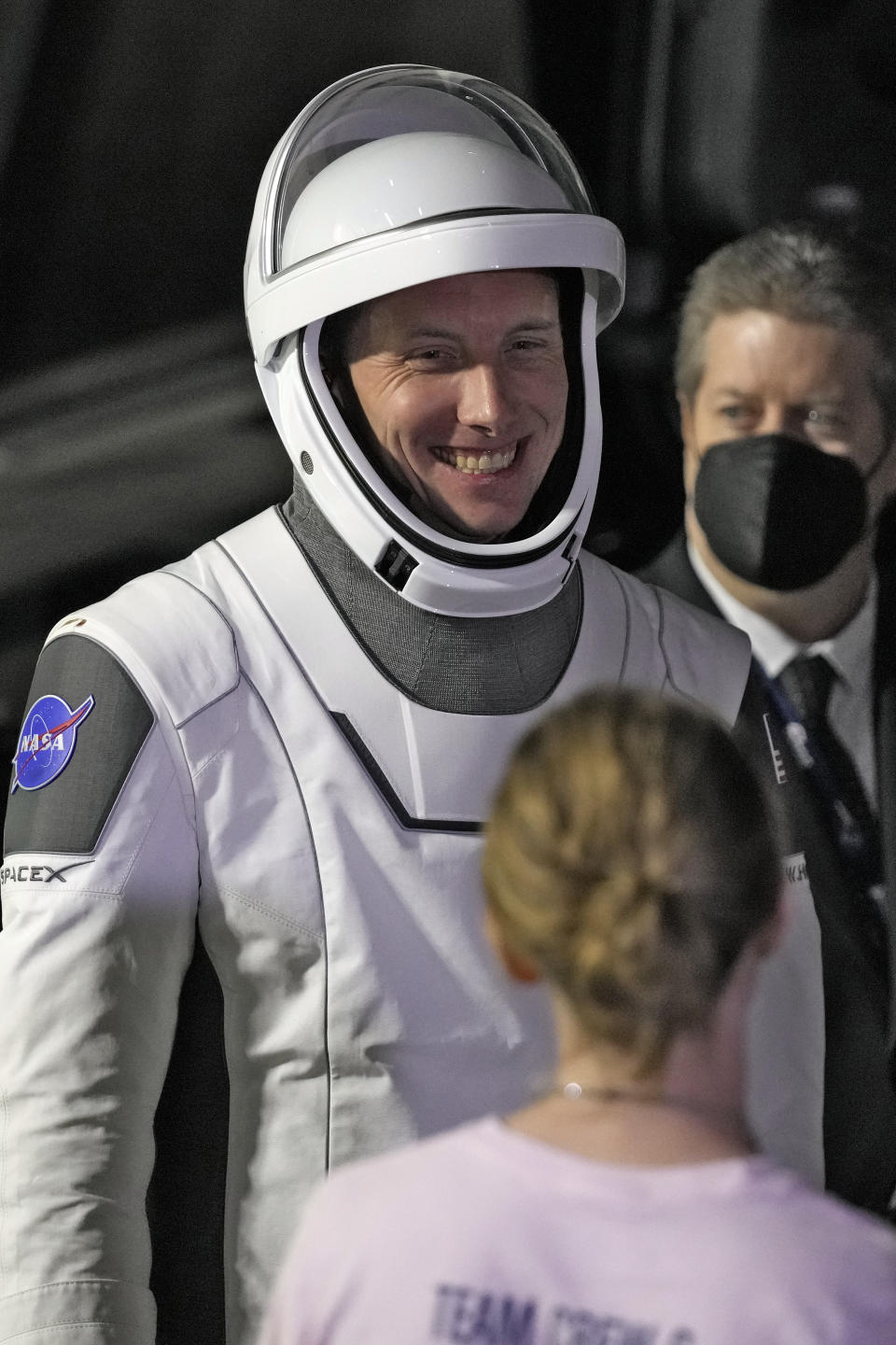 Pilot Warren Hoburg smiles as he talks to family members after leaving the Operations and Checkout building for a trip to Launch Pad 39-A, Wednesday, March 1, 2023, at the Kennedy Space Center in Cape Canaveral, Fla. Four astronauts are scheduled to liftoff early Thursday morning on a trip to the International Space Station. (AP Photo/John Raoux)