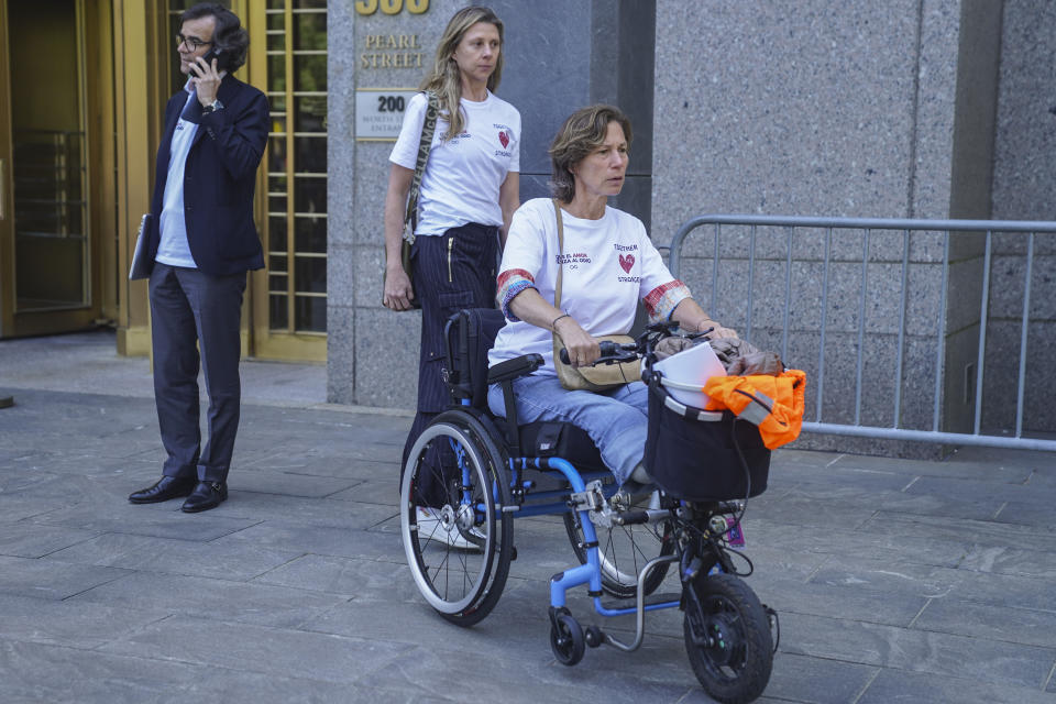 Marion Van Reeth, right, and her husband Aristide Melissas, left, leave Manhattan federal court after making victim statements at the sentencing hearing of convicted Islamic terrorist Sayfullo Saipov, Wednesday May 17, 2023, in New York. Saipov carried out an attack on Halloween in 2017 when he ran his rented truck onto a bike path in lower Manhattan killing eight people and injuring others, including Reeth and Melissas. (AP Photo/Bebeto Matthews)