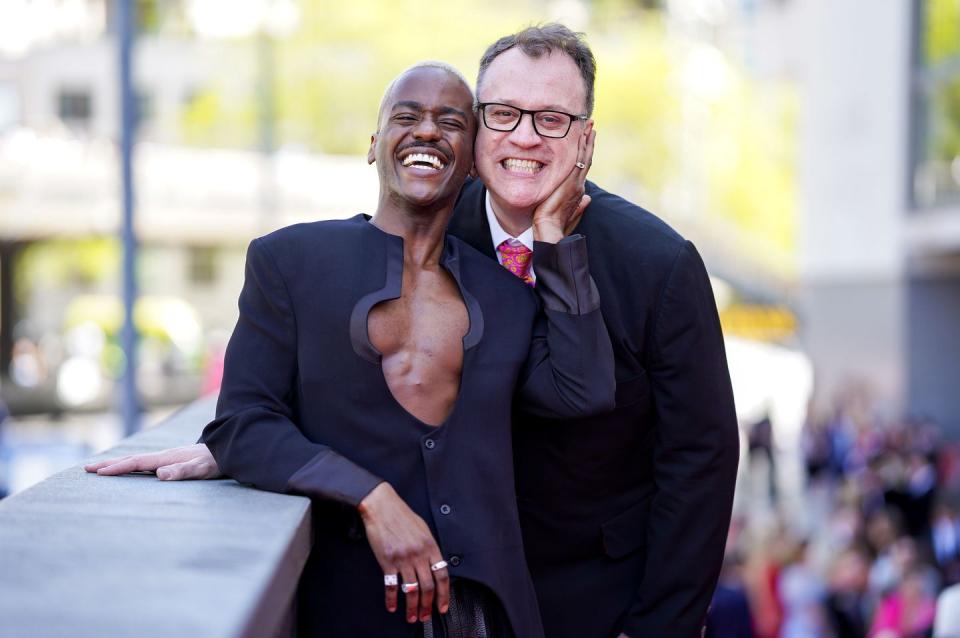 Doctor Who star Ncuti Gatwa and showrunner Russell T. Davies hug and smile at the BAFTAs