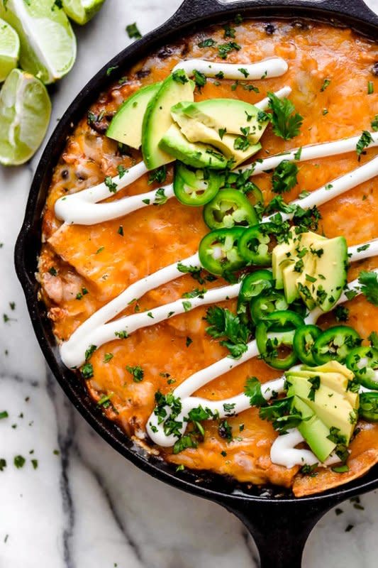 <p>Skinny Taste</p><p>This is about as fast as enchiladas can get, and that’s because it’s a tortilla casserole made all in one cooking vessel.</p><p><strong>Get the recipe: <a href="https://www.skinnytaste.com/cheesy-rotisserie-chicken-enchilada-skillet/" rel="nofollow noopener" target="_blank" data-ylk="slk:Cheesy Rotisserie Chicken Enchilada Skillet;elm:context_link;itc:0;sec:content-canvas" class="link ">Cheesy Rotisserie Chicken Enchilada Skillet</a></strong></p>