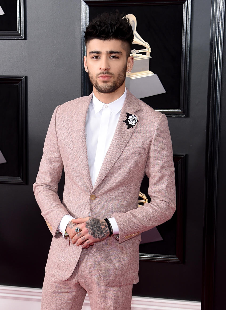 <p>Zayn held it down for the fellas in the grooming department at the Grammys. However, Joanna Simkin was the woman behind this well-groomed look. Her product of choice: <a rel="nofollow noopener" href="https://www.baxterofcalifornia.com/clay-pomade/PPDBOC838364004019.html?cgid=hair-care-pomades#start=1&cgid=hair-care-pomades" target="_blank" data-ylk="slk:Baxter of California Clay Pomade;elm:context_link;itc:0;sec:content-canvas" class="link ">Baxter of California Clay Pomade</a> ($23). The pro started with a dime-size amount of the pomade, and warmed it between her palms to make sure there were no clumps of product or too much concentration of the product in any one section of hair. (Photo: Jamie McCarthy/Getty Images) </p>