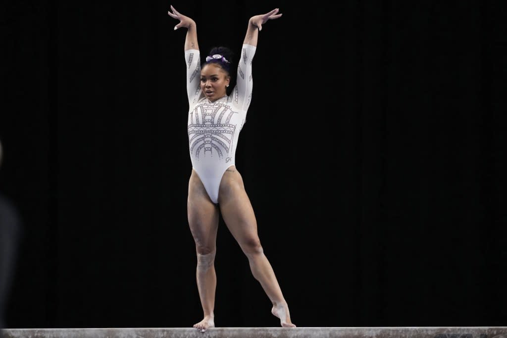 LSU’s Konnor McClain competes on the balance beam during the NCAA women’s gymnastics championships in Fort Worth, Texas, Saturday, April 20, 2024. (AP Photo/Tony Gutierrez)