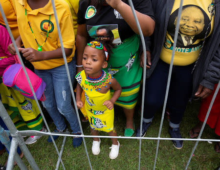 A young supporter dances as people await the arrival of South African President Cyril Ramaphosa at an African National Congress (ANC) election rally in Tongaat, near Durban, South Africa, May 4, 2019. REUTERS/Rogan Ward