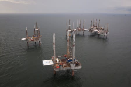 FILE PHOTO: Unused oil rigs sit in the Gulf of Mexico near Port Fourchon, Louisiana