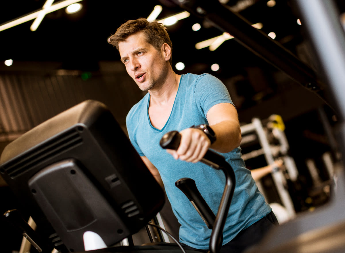 fit man on elliptical, concept of cardio exercises to stay fit as you age