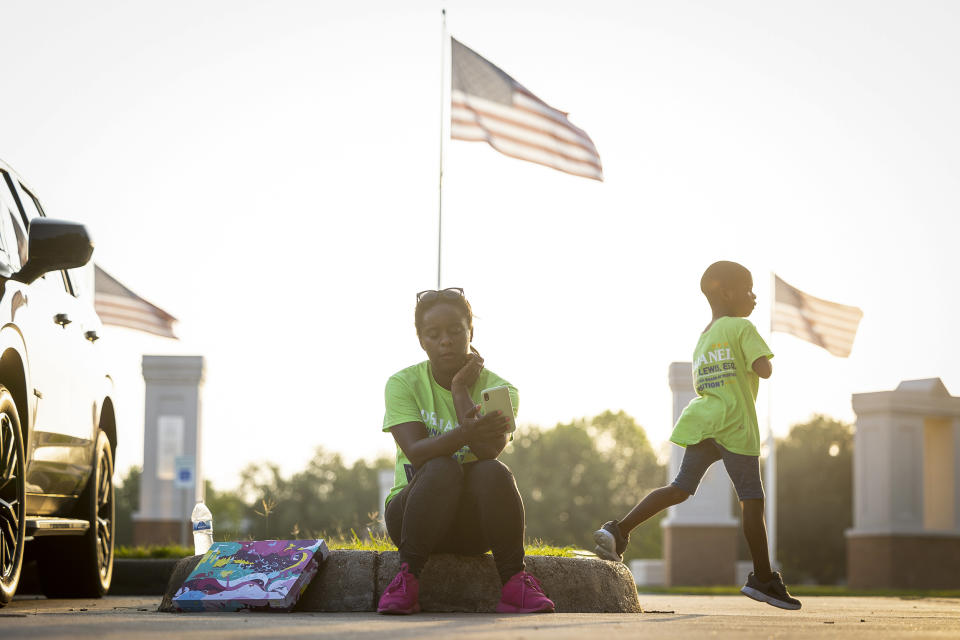 School board trustee hopeful Orjanel Lewis begins watching results after the polls close outside of the Missouri City City Hall on May 7, 2022, in Ft. Bend County, Texas. (Annie Mulligan for NBC News)