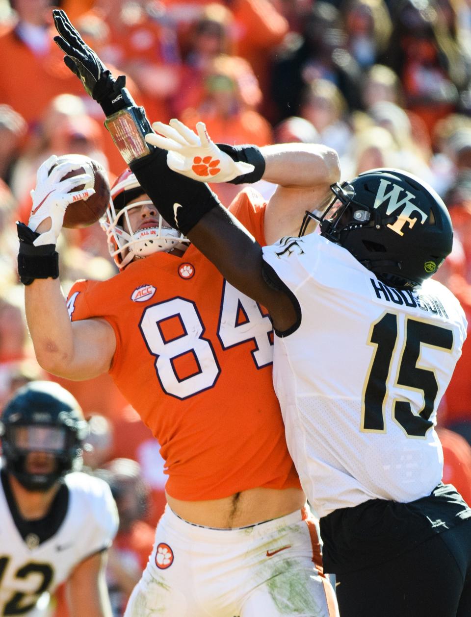 Clemson tight end Davis Allen (84) catches the ball to score a touchdown as Wake Forest linebacker Jaylen Hudson (15) puts on the pressure during their game at Memorial Stadium Saturday, Nov. 20, 2021.