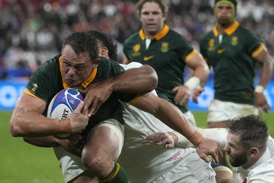 South Africa's Deon Fourie is tackled during the Rugby World Cup semifinal match between England and South Africa at the Stade de France in Saint-Denis, outside Paris, Saturday, Oct.21, 2023. (AP Photo/Thibault Camus)