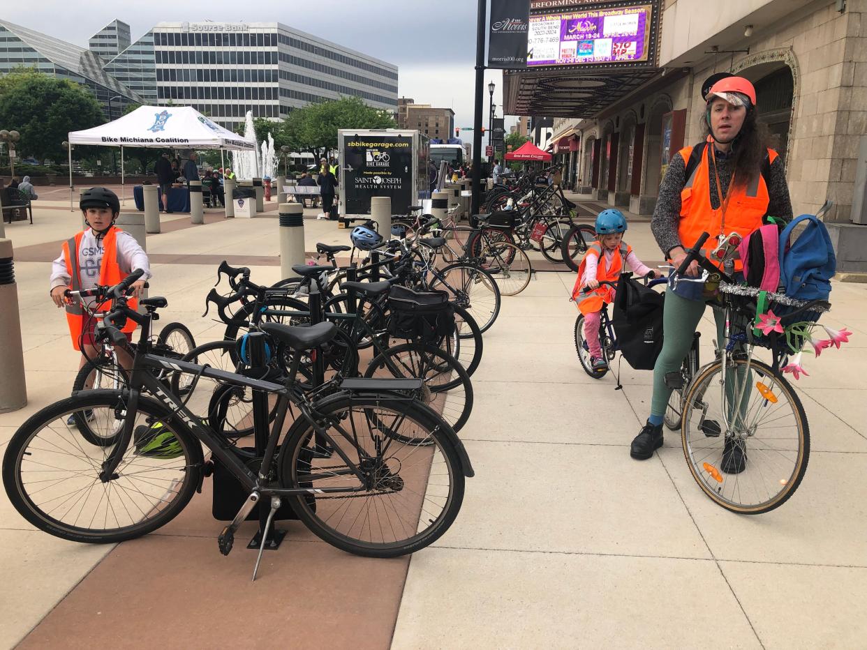 Bike commuters arrive at 2023's Michiana Bike to Work Week pancake breakfast at the Jon Hunt Memorial Plaza in South Bend.