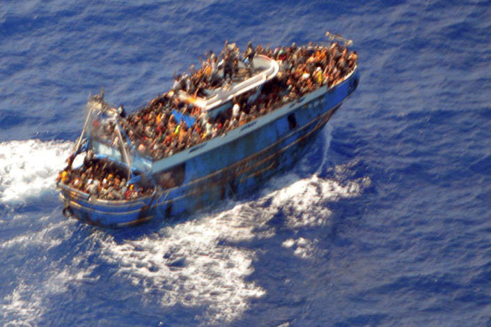 An undated photo provided by the Greek Coast Guard shows migrants on a boat before it capsizes near the deepest part of the Mediterranean Sea, off Greece, June 14, 2023. / Credit: HELLENIC COAST GUARD / REUTERS