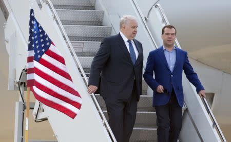 Dmitry Medvedev (R), prime minister of Russia, walks with Sergei Kislyak, Russian ambassador to the U.S., as he arrives for the G8 Summit at Dulles International Airport in Chantilly, Virginia May 18, 2012. REUTERS/Joshua Roberts