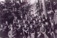 <span>Group shot taken at Stalag Luft I in 1945. Merrill Weicker is 3rd from the left of the tree in the top row. Photo courtesy of <a href="http://www.thememoryproject.com/stories/832:merrill-weicker/" rel="nofollow noopener" target="_blank" data-ylk="slk:Historica-Dominion Institute;elm:context_link;itc:0;sec:content-canvas" class="link ">Historica-Dominion Institute</a>. </span>