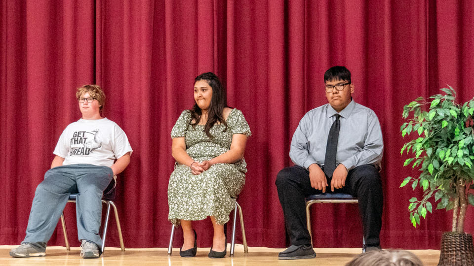 Healy's three-student eighth-grade class appears at a May 16, 2024, graduation ceremony.