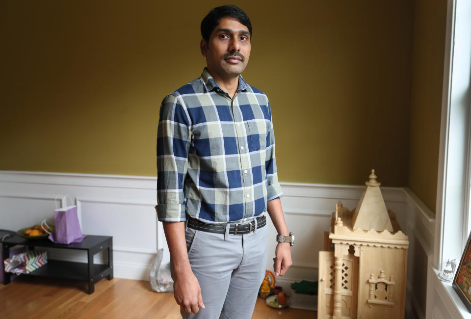 Srikanth Paladugu poses for a portrait in Hopkinton, MA on Aug. 31, 2018. Paladugu has been waiting for a green card since 2012. His application was approved several years ago, but because of an immigration backlog for Indian nationals, he has been unable to get permanent residency.  (Suzanne Kreiter/The Boston Globe via Getty Images)