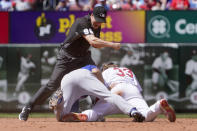 St. Louis Cardinals' Brendan Donovan (33) is tagged out by Chicago Cubs' David Bote on a failed stolen base attempt as second base umpire Chris Segal (96) makes the call during the fifth inning of a baseball game Sunday, June 26, 2022, in St. Louis. (AP Photo/Jeff Roberson)