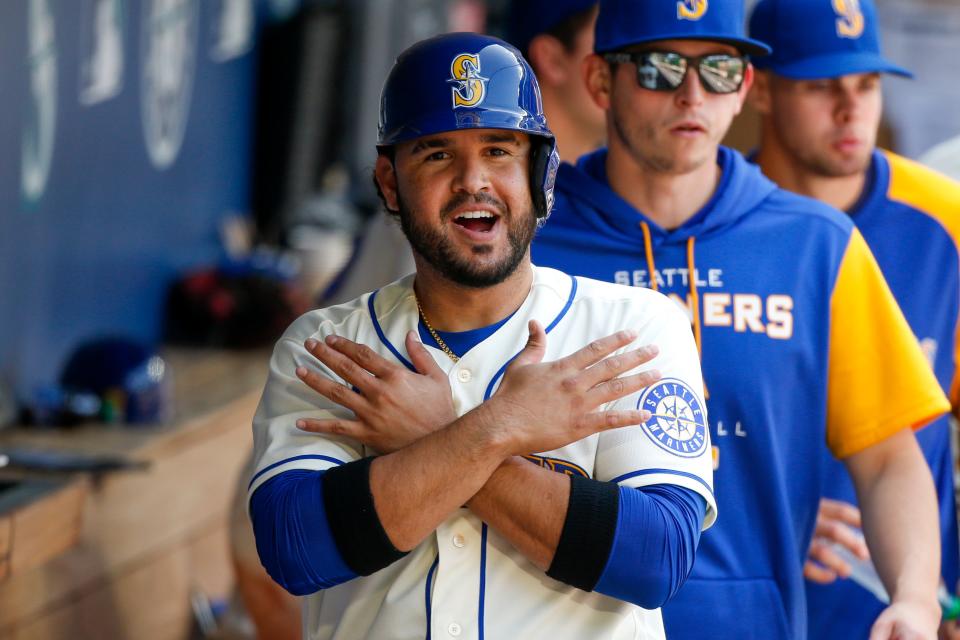 Apr 24, 2022; Seattle, Washington, USA; Seattle Mariners third baseman Eugenio Suarez (28) celebrates in the dugout after scoring a run against the Kansas City Royals during the sixth inning at T-Mobile Park. Mandatory Credit: Joe Nicholson-USA TODAY Sports