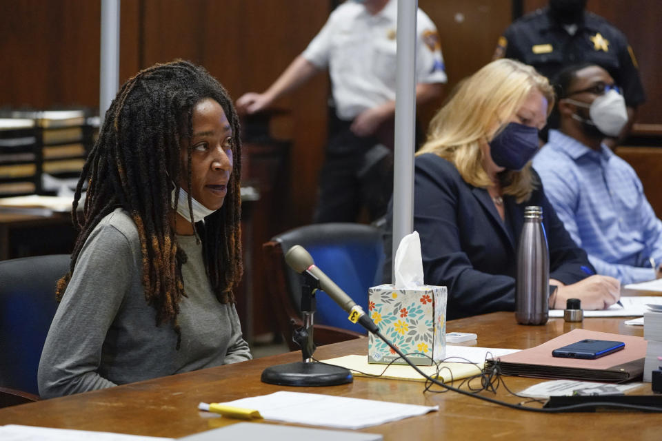 Tiffany Taylor, left, who survived an attack by Khalil Wheeler-Weaver, right, speaks during his sentencing in Newark, N.J., Wednesday, Oct. 6, 2021. Wheeler-Weaver, a New Jersey man who used dating apps to lure three women, including Sarah Butler, to their deaths and attempted to kill a fourth woman five years ago, was sentenced to 160 years in prison on Wednesday, as he defiantly proclaimed his innocence. (AP Photo/Seth Wenig, Pool)