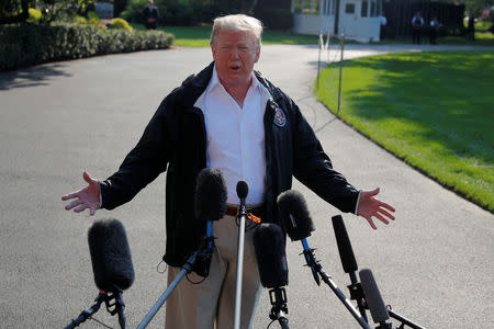 U.S. President Donald Trump speaks to reporters before departing the White House in Washington, U.S., September 19, 2018. REUTERS/Brian Snyder