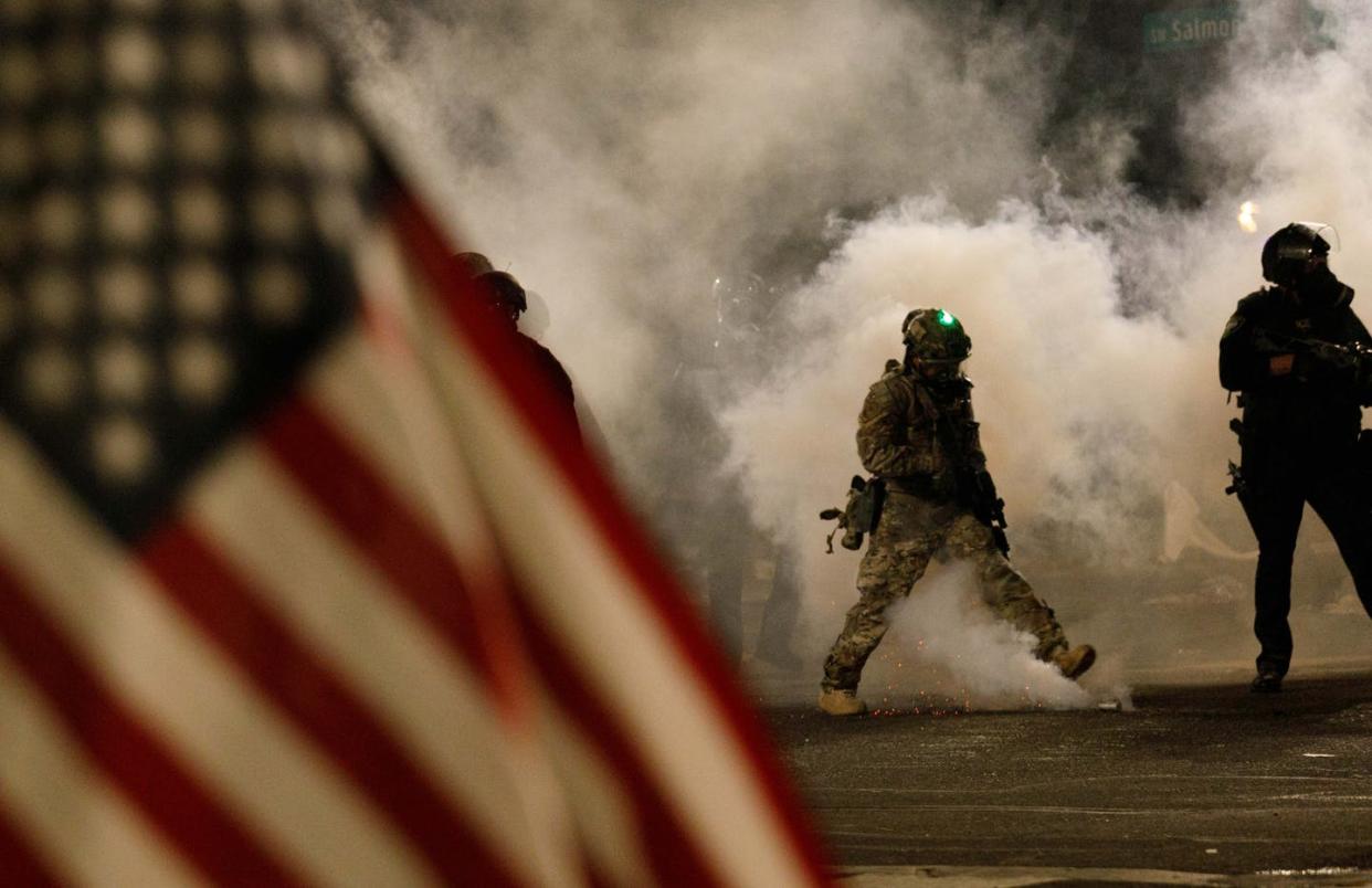 <span class="caption">Federal officers using large amounts of tear gas against protesters in Portland, Oregon on July 21.</span> <span class="attribution"><a class="link " href="https://www.gettyimages.com/detail/news-photo/federal-officers-deploy-huge-quantities-of-cs-tear-gas-in-news-photo/1227734754?adppopup=true" rel="nofollow noopener" target="_blank" data-ylk="slk:John Rudoff/Anadolu Agency via Getty Images;elm:context_link;itc:0;sec:content-canvas">John Rudoff/Anadolu Agency via Getty Images</a></span>