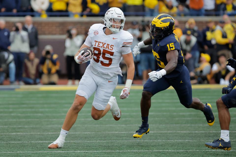 Texas tight end Gunnar Helm turns upfield for more yards after making a catch in the first half of Saturday's 31-12 over Michigan. Helm had a career day against the Wolverines, leading the team with seven catches for 98 yards and a touchdown. "He's always in the right spot today, it seemed like," UT quarterback Quinn Ewers said.