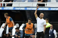 Manchester City's head coach Pep Guardiola gestures during the English Premier League soccer match between Newcastle United and Manchester City at St James Park in Newcastle, England, Sunday, Aug.21, 2022. (AP Photo/Rui Vieira)