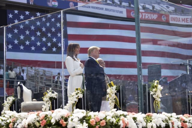 Donald and Melania Trump stand for the national anthem