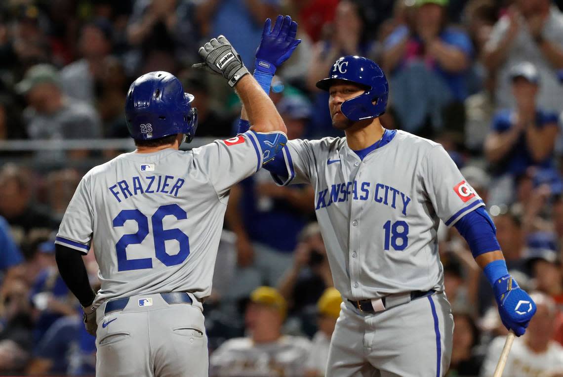 Kansas City Royals first baseman Yuli Gurriel (18) greets third baseman Adam Frazier (26) crossing home plate on a solo home run against the Pittsburgh Pirates during the eighth inning at PNC Park on Sep 13, 2024 in Pittsburgh, Pennsylvania. 